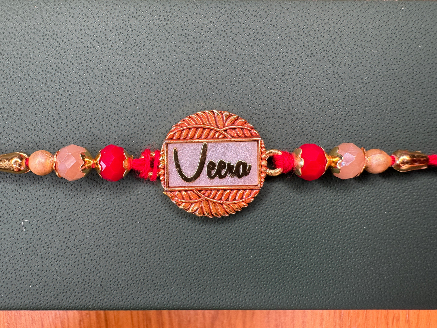 Pastel Bloom Rakhi with Floral Centerpiece – Elegant & Colorful Charm