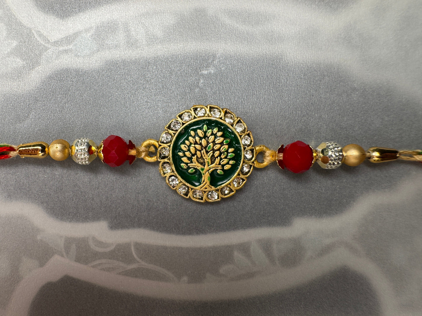 Pastel Bloom Rakhi with Floral Centerpiece – Elegant & Colorful Charm