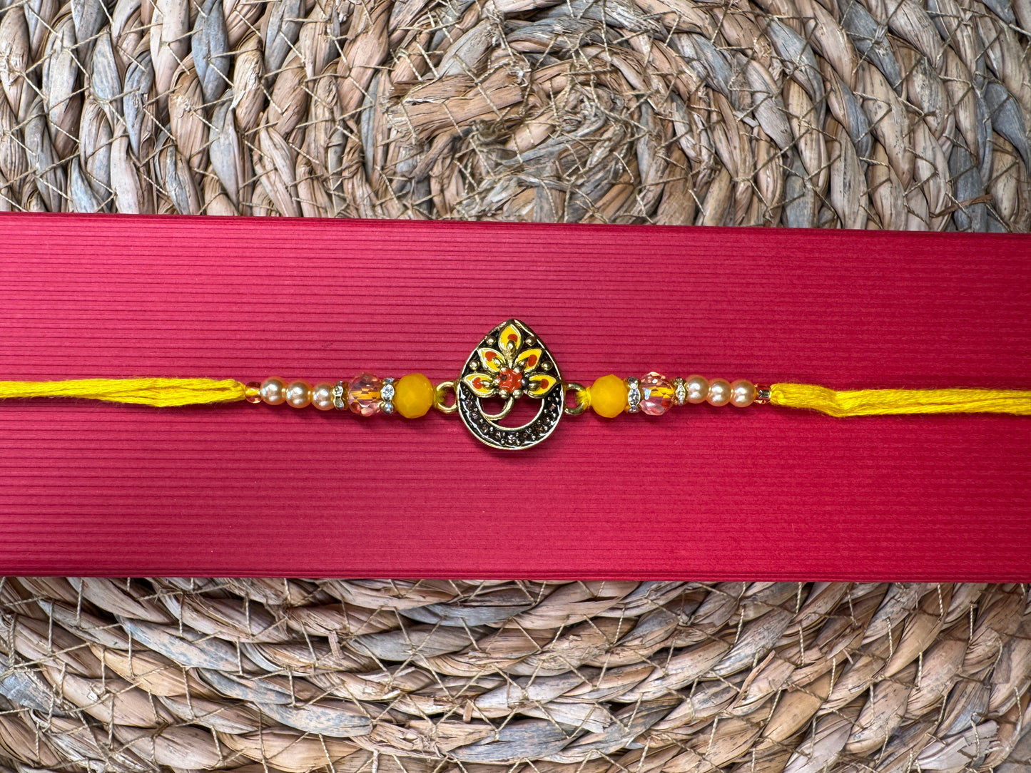 Royal Teardrop Rakhi with Kundan & Bead Detailing – Elegant & Traditional