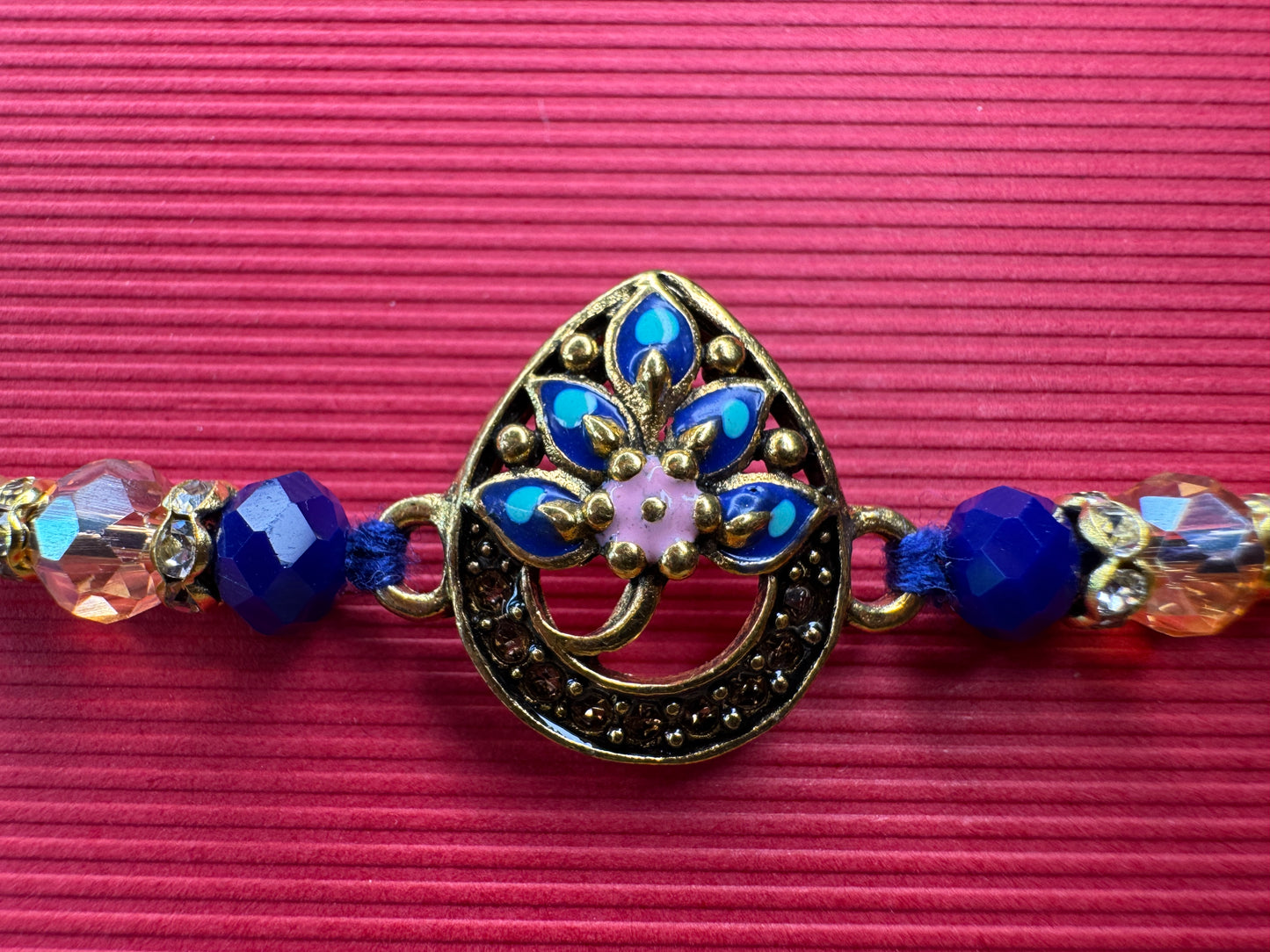Royal Teardrop Rakhi with Kundan & Bead Detailing – Elegant & Traditional