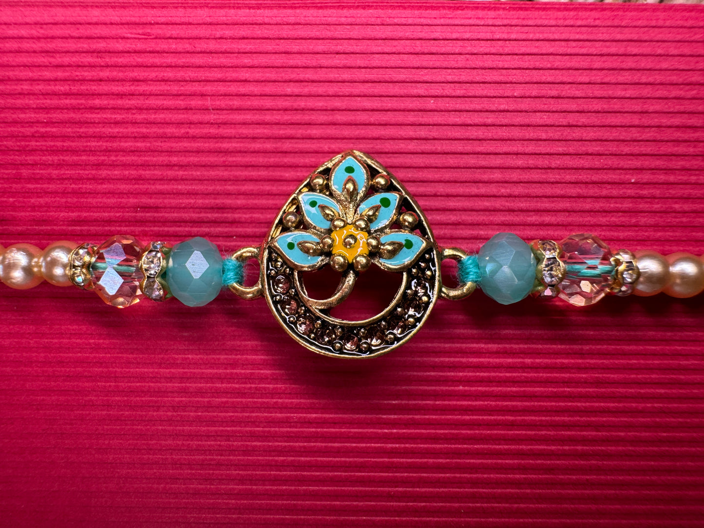Royal Teardrop Rakhi with Kundan & Bead Detailing – Elegant & Traditional