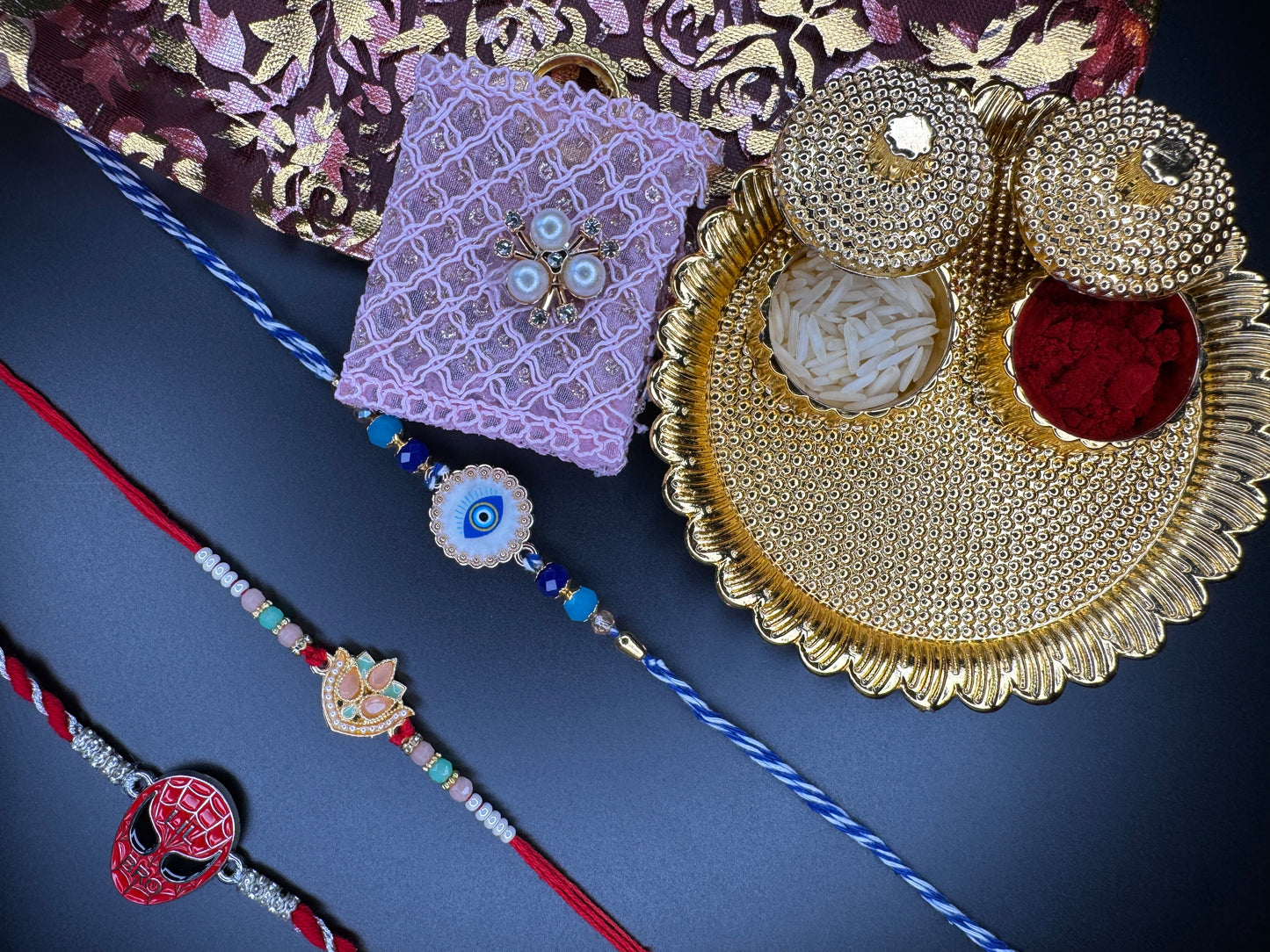 Mini Rakhi Celebration Combo – 3 Rakhis with Pooja Thali & Tikka Bag