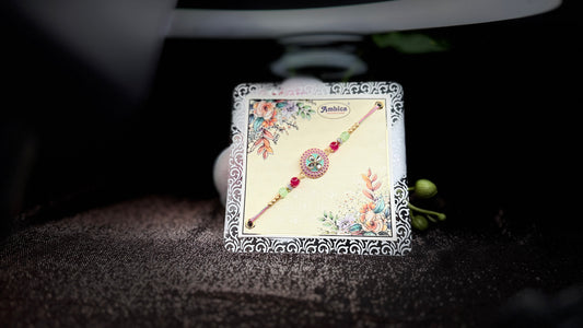 Pastel Bloom Rakhi with Floral Centerpiece – Elegant & Colorful Charm