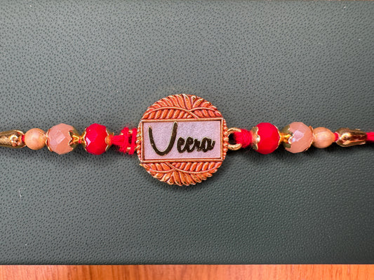 Pastel Bloom Rakhi with Floral Centerpiece – Elegant & Colorful Charm