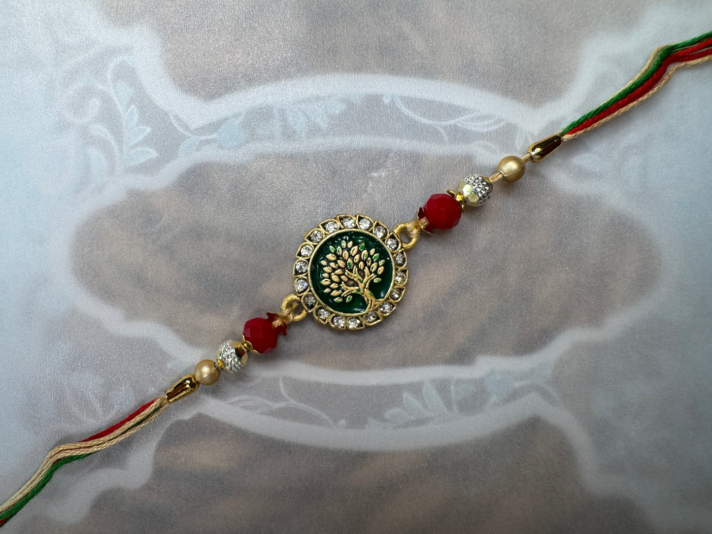 Pastel Bloom Rakhi with Floral Centerpiece – Elegant & Colorful Charm