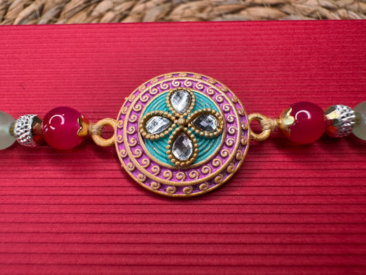 Pastel Bloom Rakhi with Floral Centerpiece – Elegant & Colorful Charm